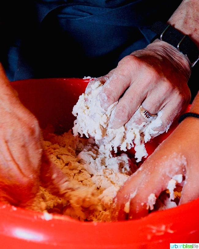 hands mixing dough in making makarounes pasta in Olympos Karpathos Greece.