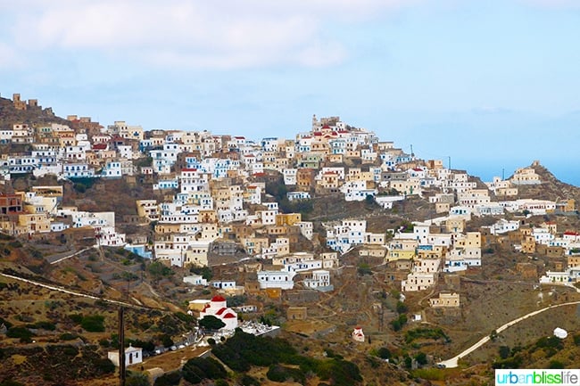 hillside stacked with houses and churches of Olympos village, on Karpathos Island, Greece.