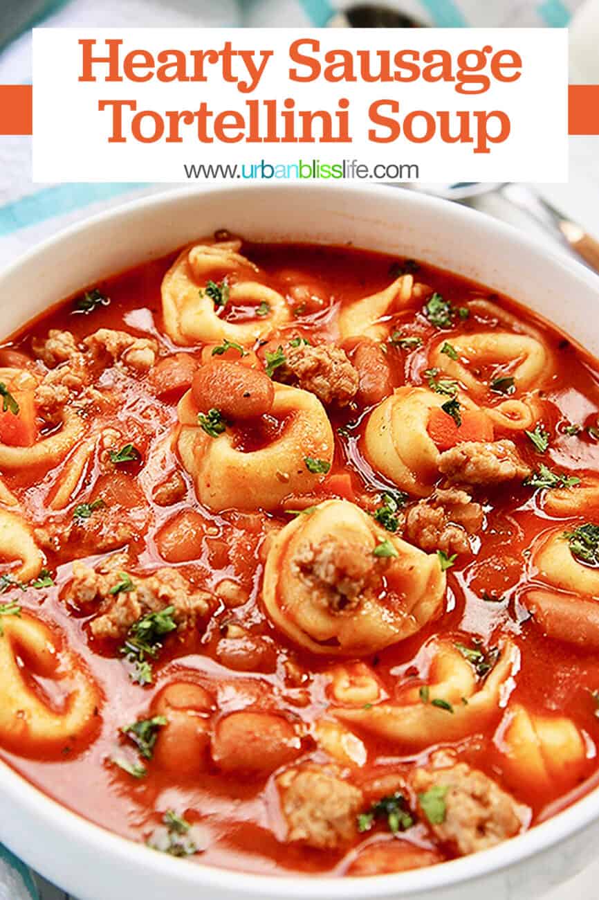 bowl of sausage tortellini soup with text overlay for Pinterest