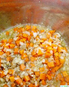 carrots, onions, garlic sauteeing in Instant Pot