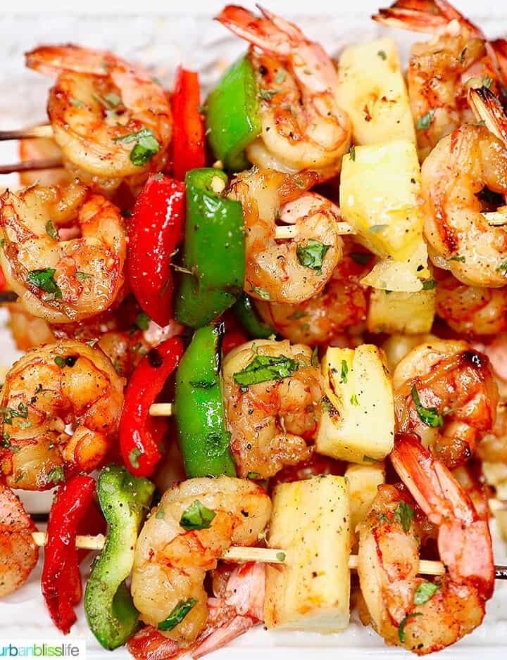 closeup of several grilled shrimp pineapple skewers served together
