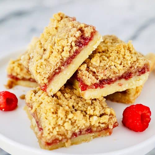 stack of Raspberry Crumble Bars on pedestal