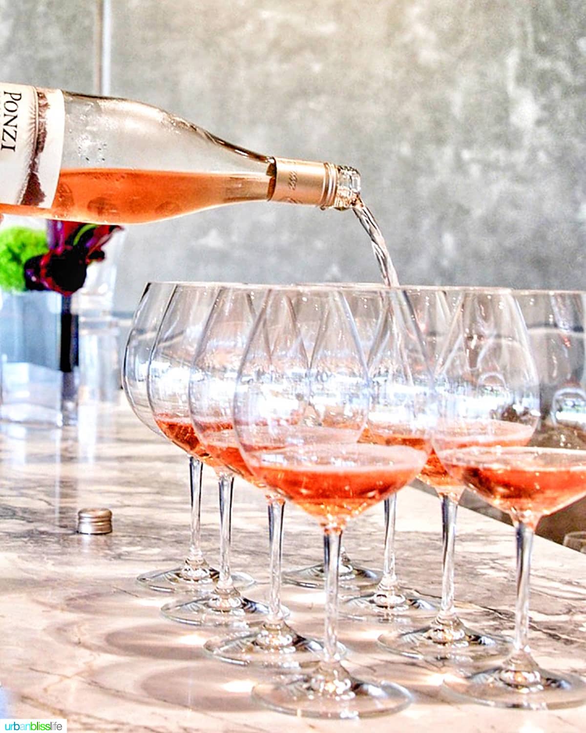 Ponzi rose wine pouring into wine glasses