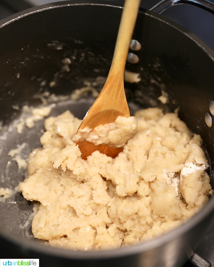 stirring together churro dough