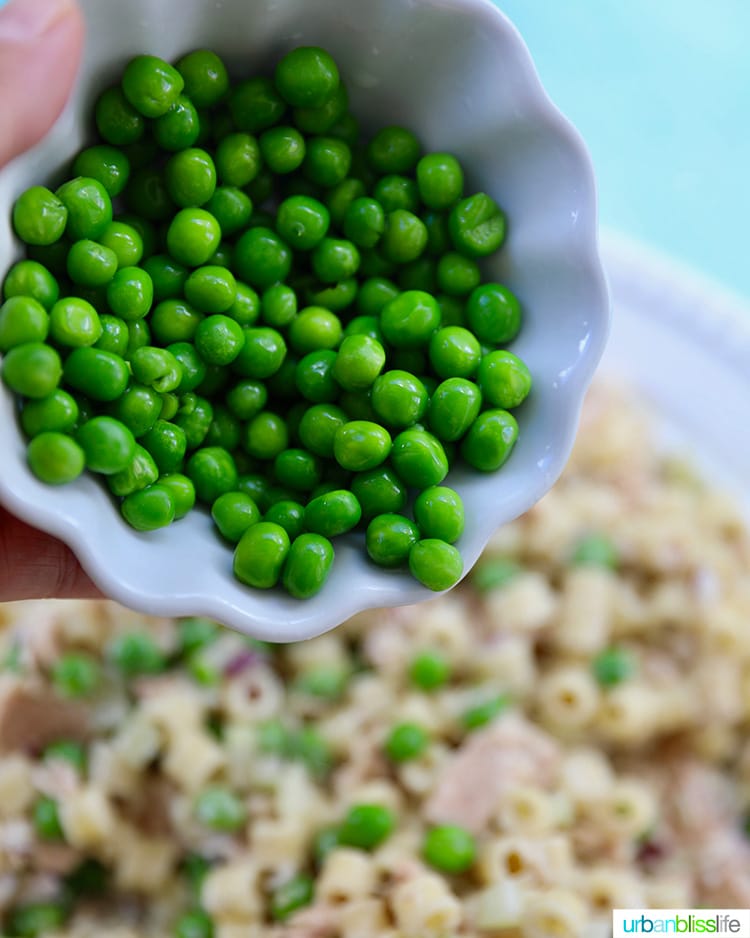 peas going into tuna pasta salad