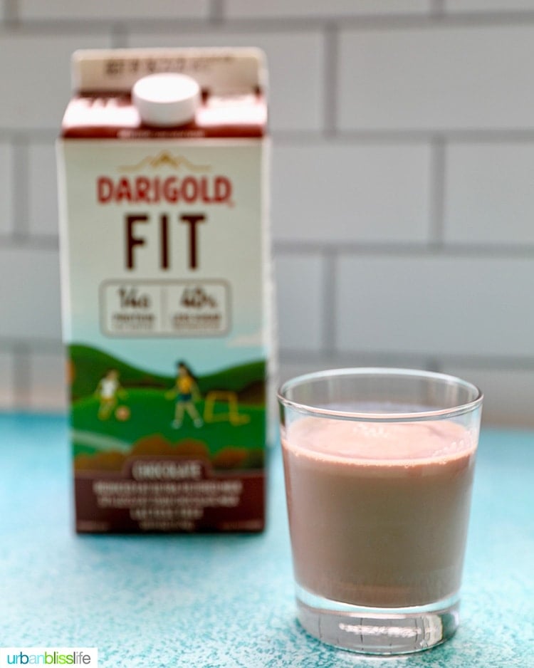 glass of Darigold FIT ultra-filtered milk chocolate milk with carton
