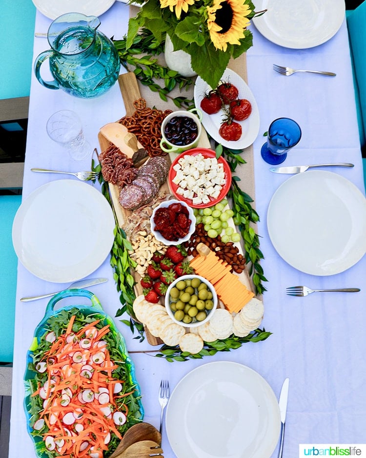 dinner party setting with fall grazing board and radish carrot salad