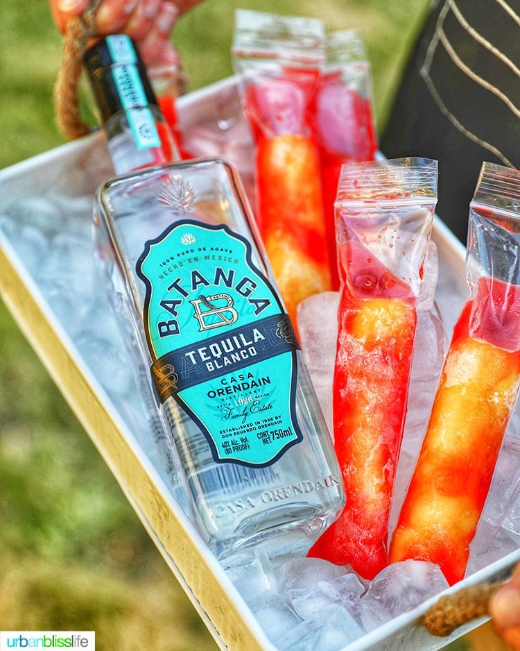 Batanga Tequila bottle withTequila Sunset Pops on ice tray