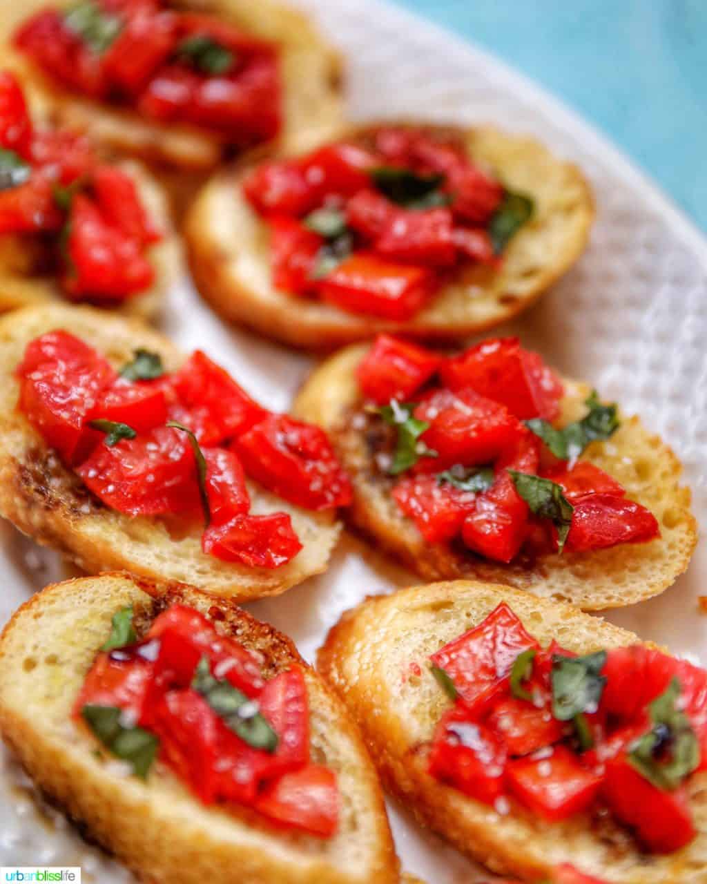 full plate of tomato bruschetta with balsamic vinegar