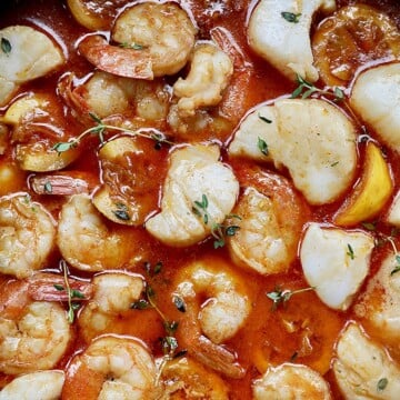 closeup of New Orleans-style BBQ shrimp and scallops