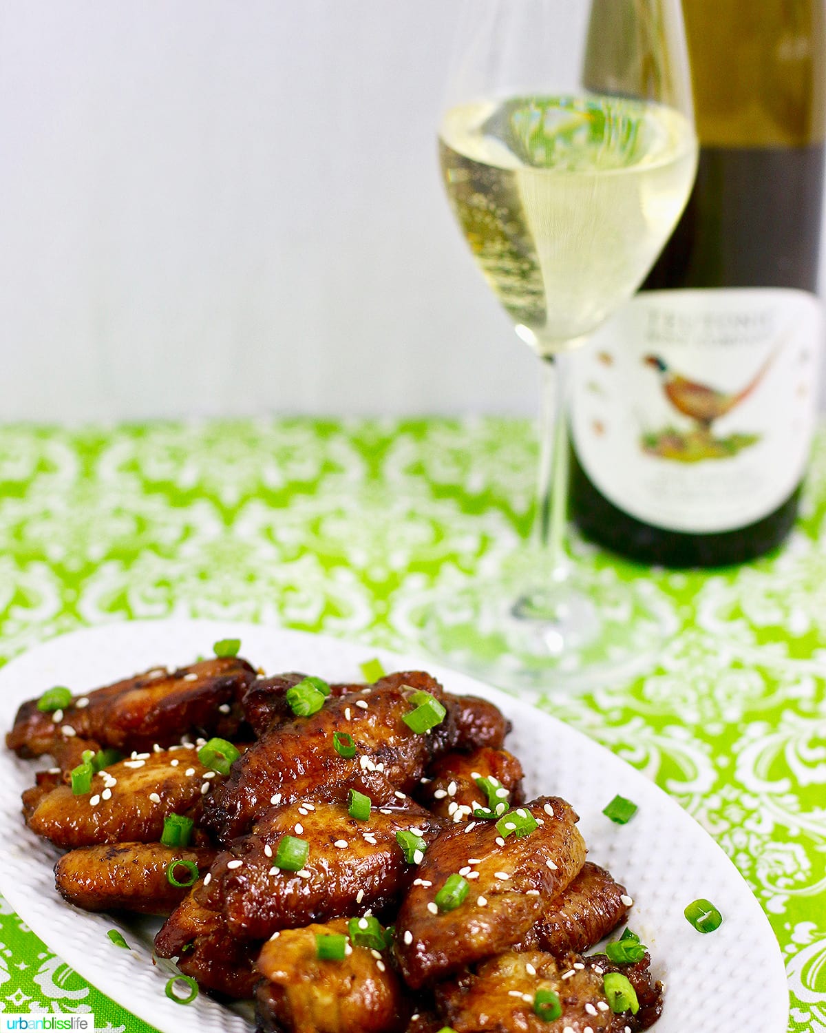 teriyaki chicken wings with a glass of Teutonic Riesling white wine