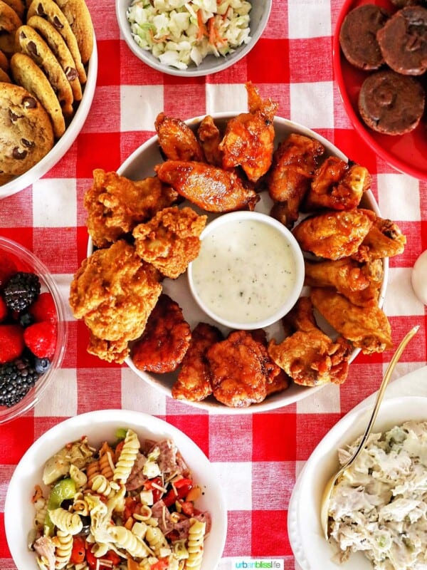 tailgating food ideas: chicken wings, pasta salad, chicken salad, cookies, brownies