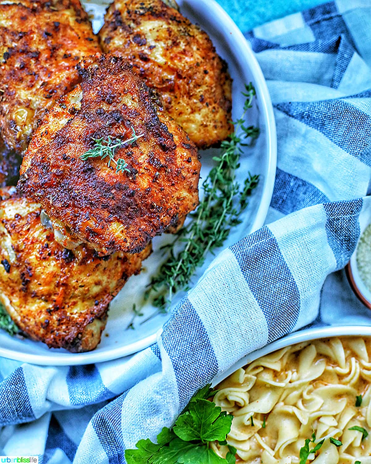 bowl of air fryer paprika chicken with bowl of paprika pasta