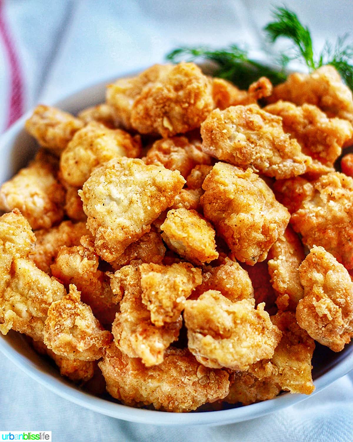 bowl full of crispy Air Fryer Popcorn Chicken.