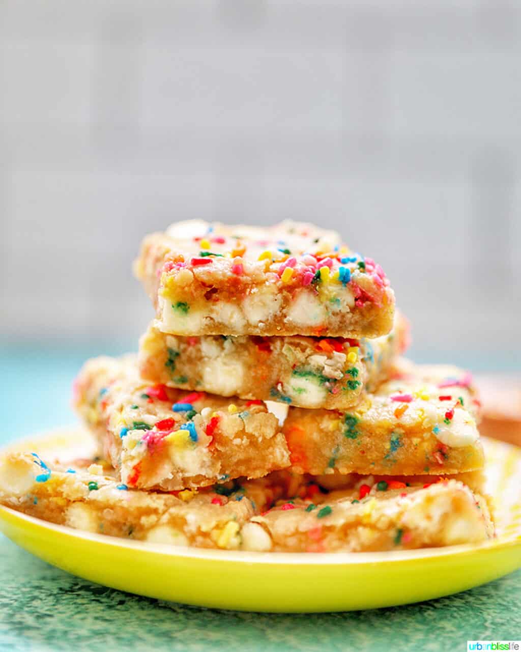 side view of stacked Funfetti Cookie Bars