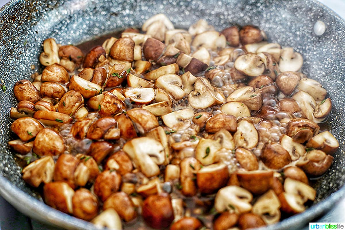 marsala wine bubbling with mushrooms in pan