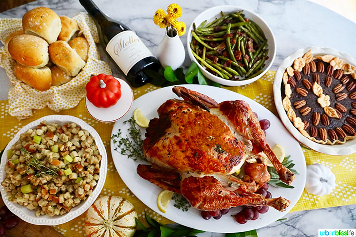 thanksgiving turkey, pie, stuffing, green beans, dinner rolls, and wine