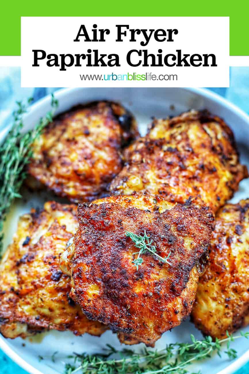plate of air fryer paprika chicken with title text overlay and green background bar