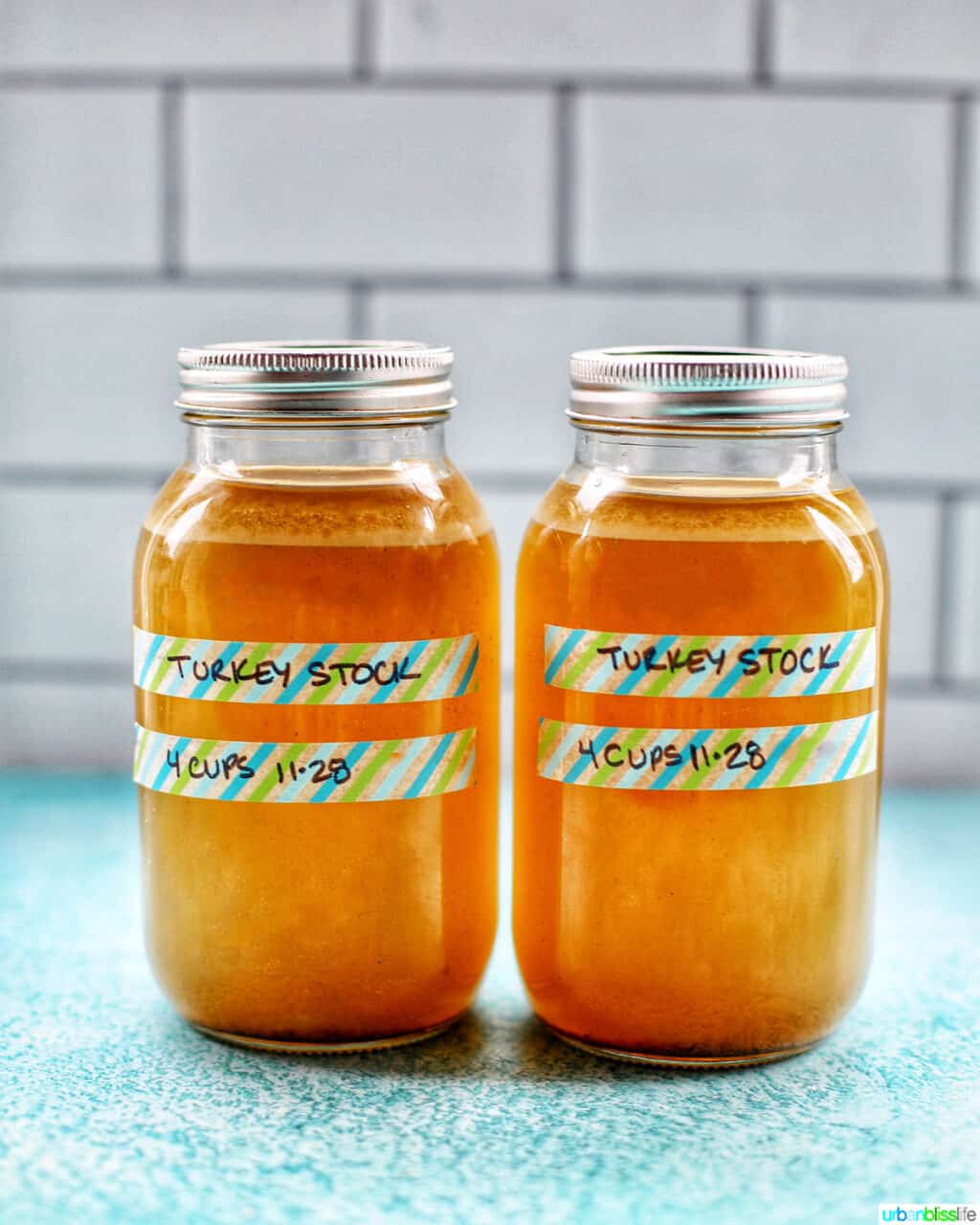 two mason jars full of Homemade Turkey Stock 