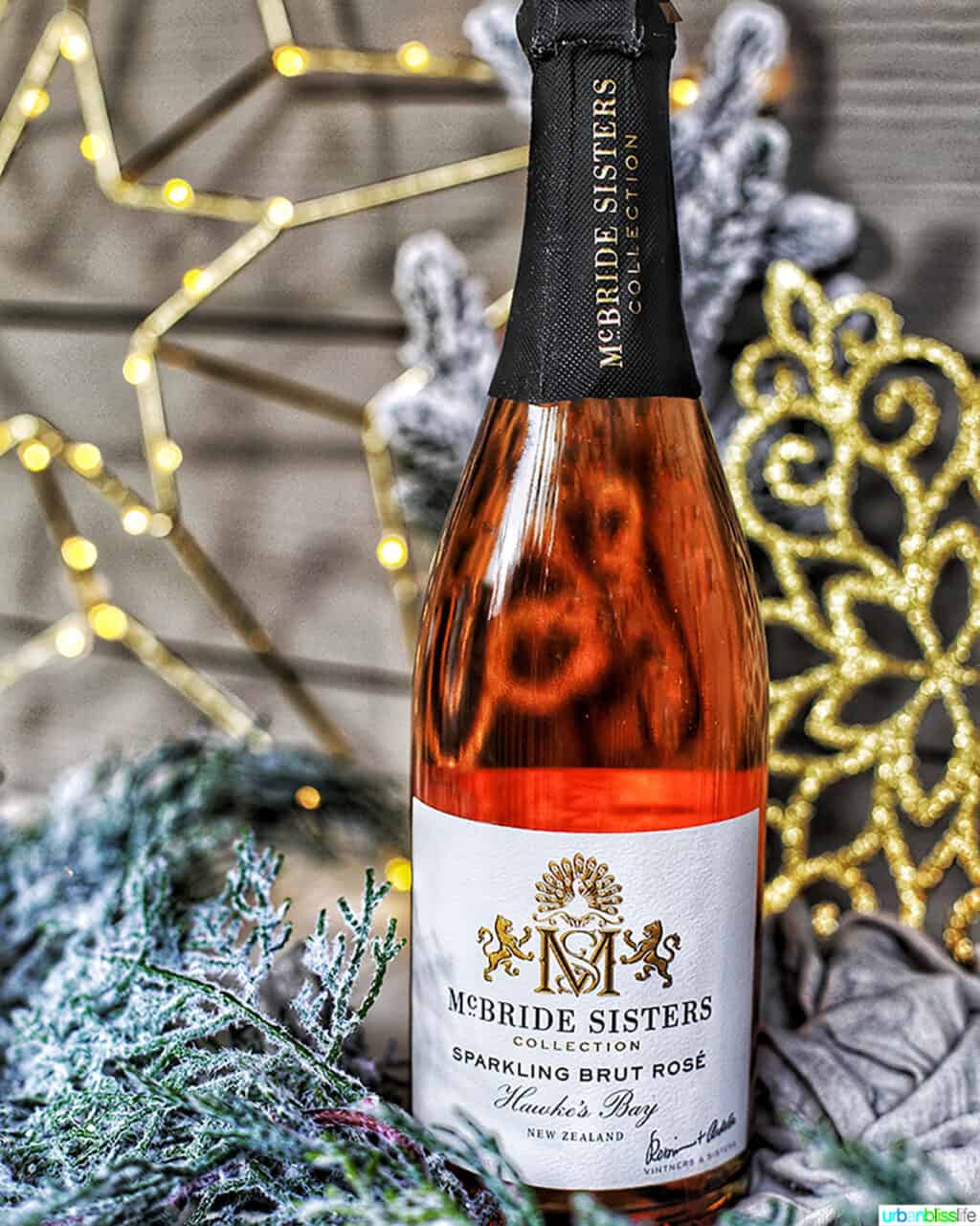 McBride Sisters Brut Rosé bottle in holiday decorations