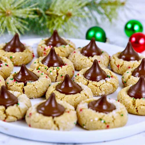 peanut butter blossom cookies with a Christmas background