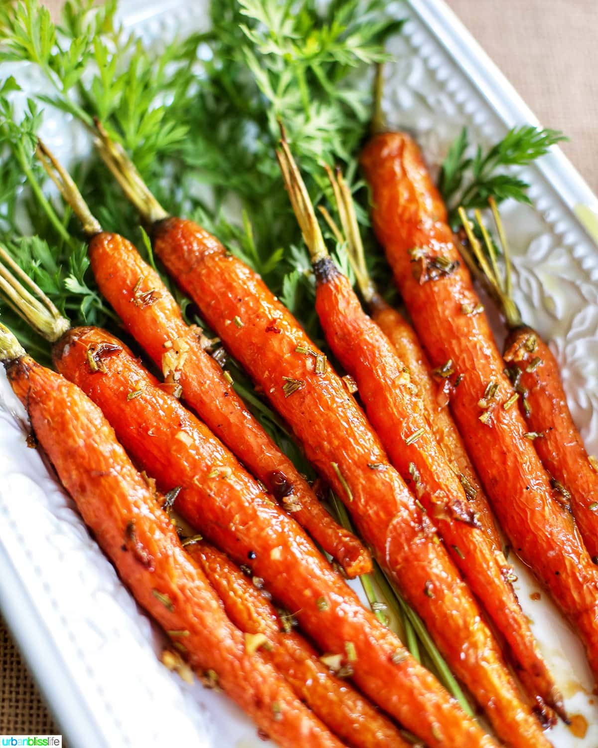 plate of garlic rosemary roasted glazed carrots angled photo