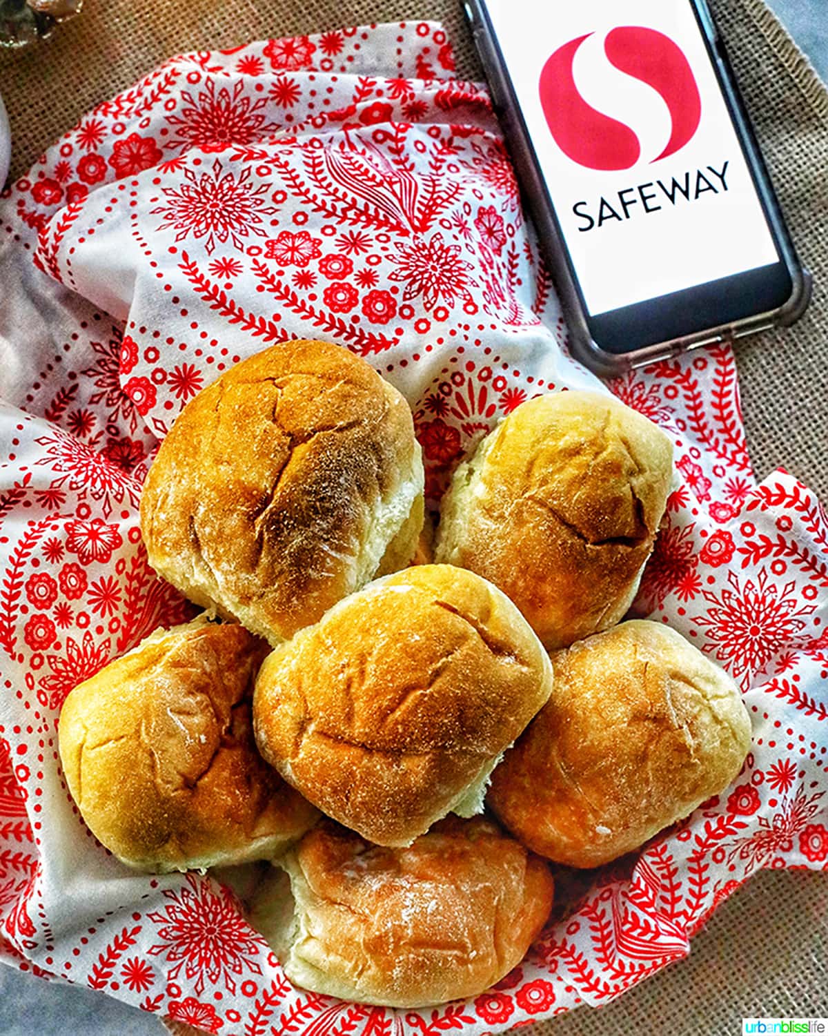 dinner rolls against red and white towel with safeway logo on phone