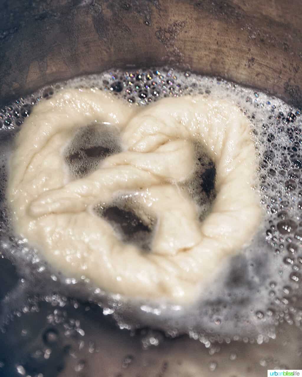 soft pretzel boiling in water