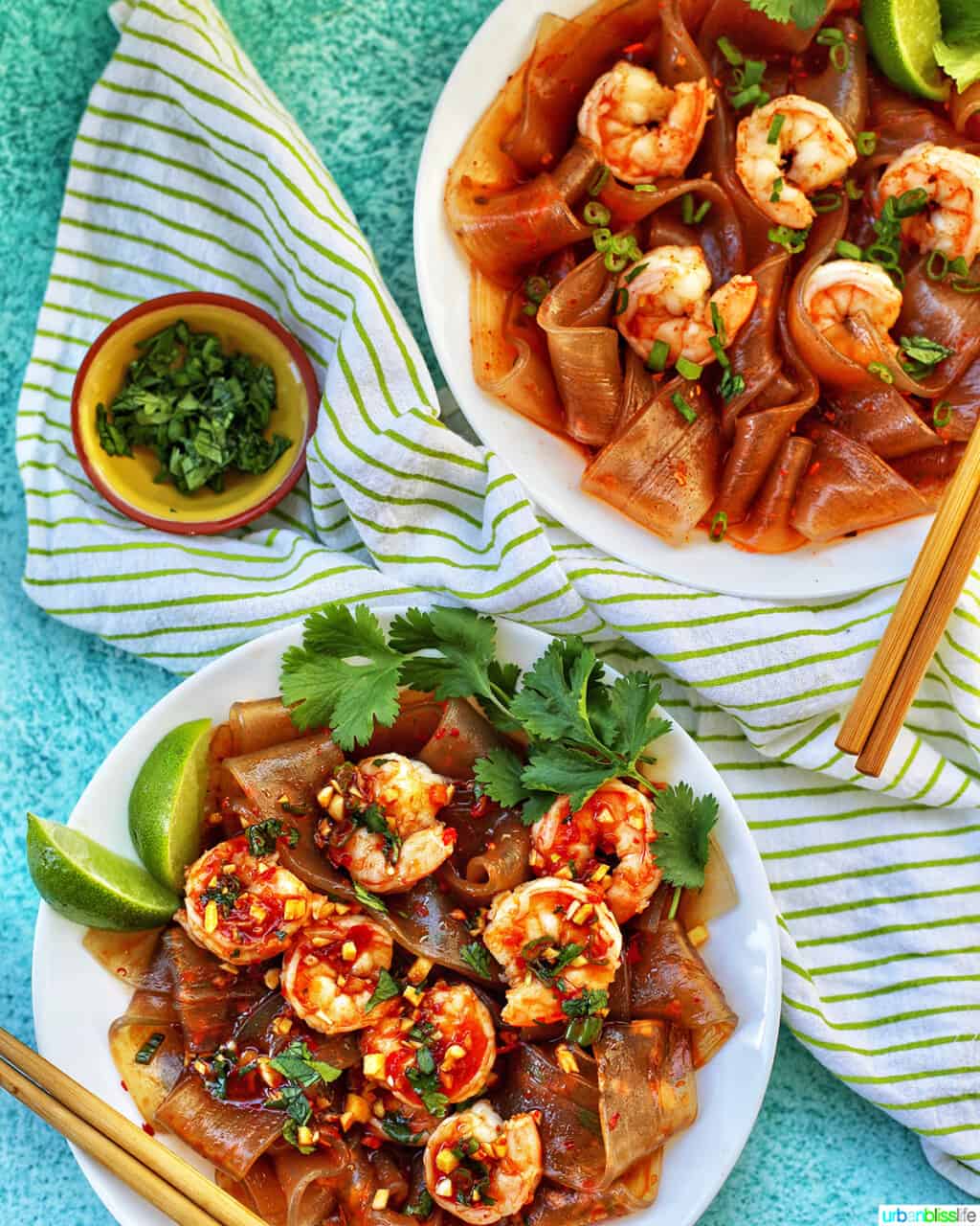 two bowls of wide glass noodles with shrimp