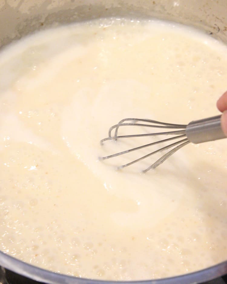 stirring dairy-free cream sauce