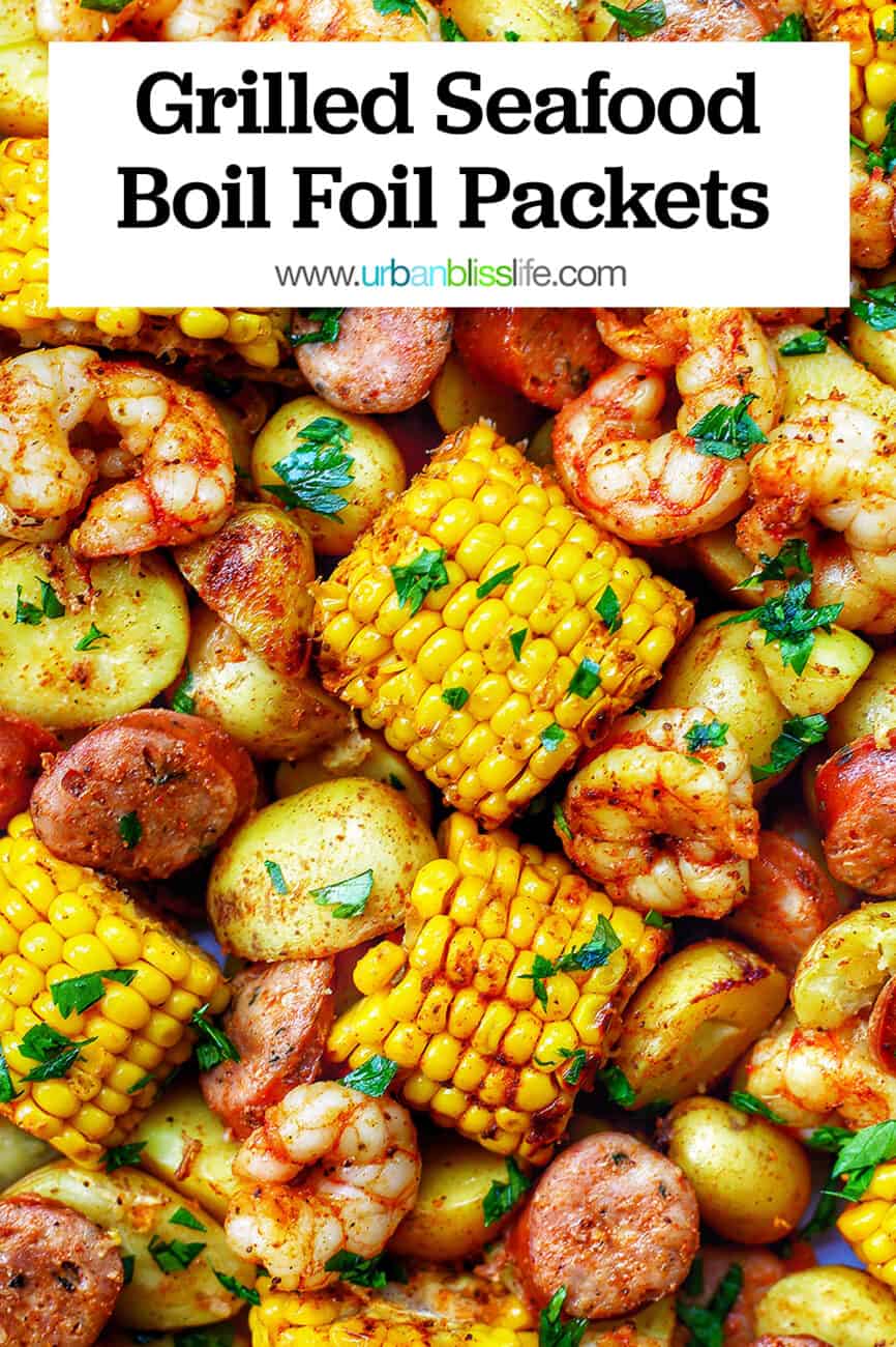 tray of seafood, corn, sausage low country boil with text overlay