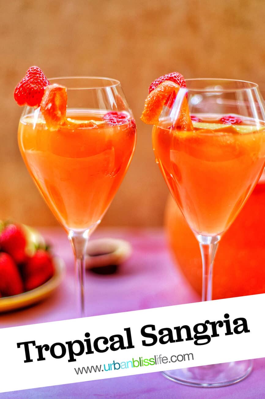 two glasses of tropical sangria with text overlay