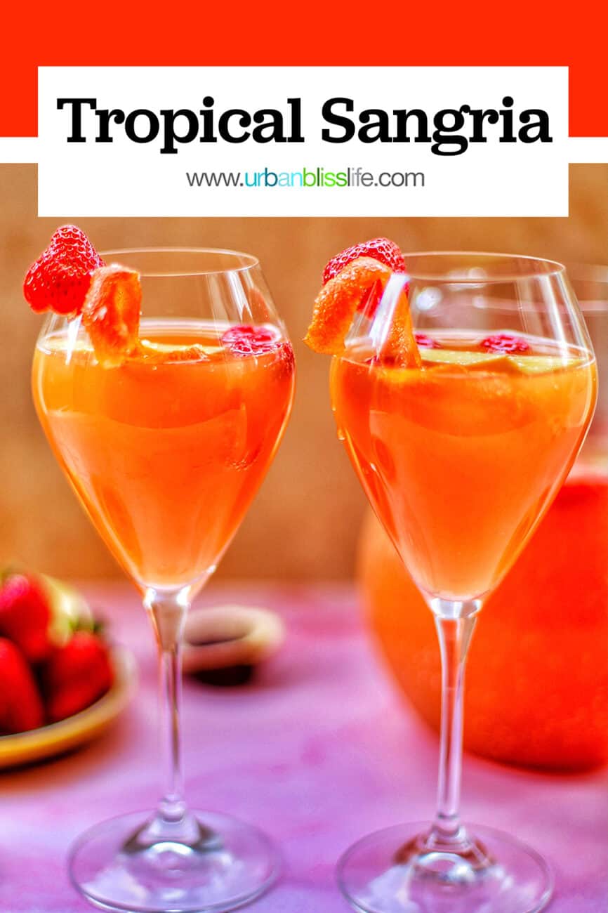 two glasses of tropical sangria with text overlay