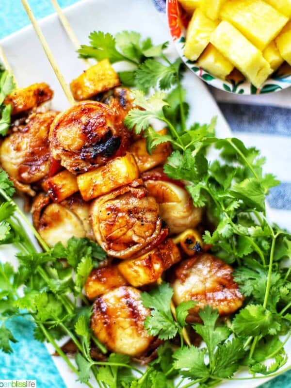 grilled bacon-wrapped scallop skewers with pineapple and parsley