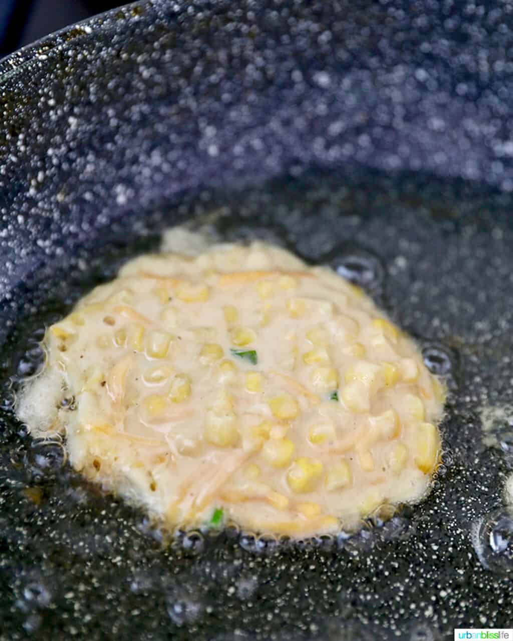 frying corn fritter in pan