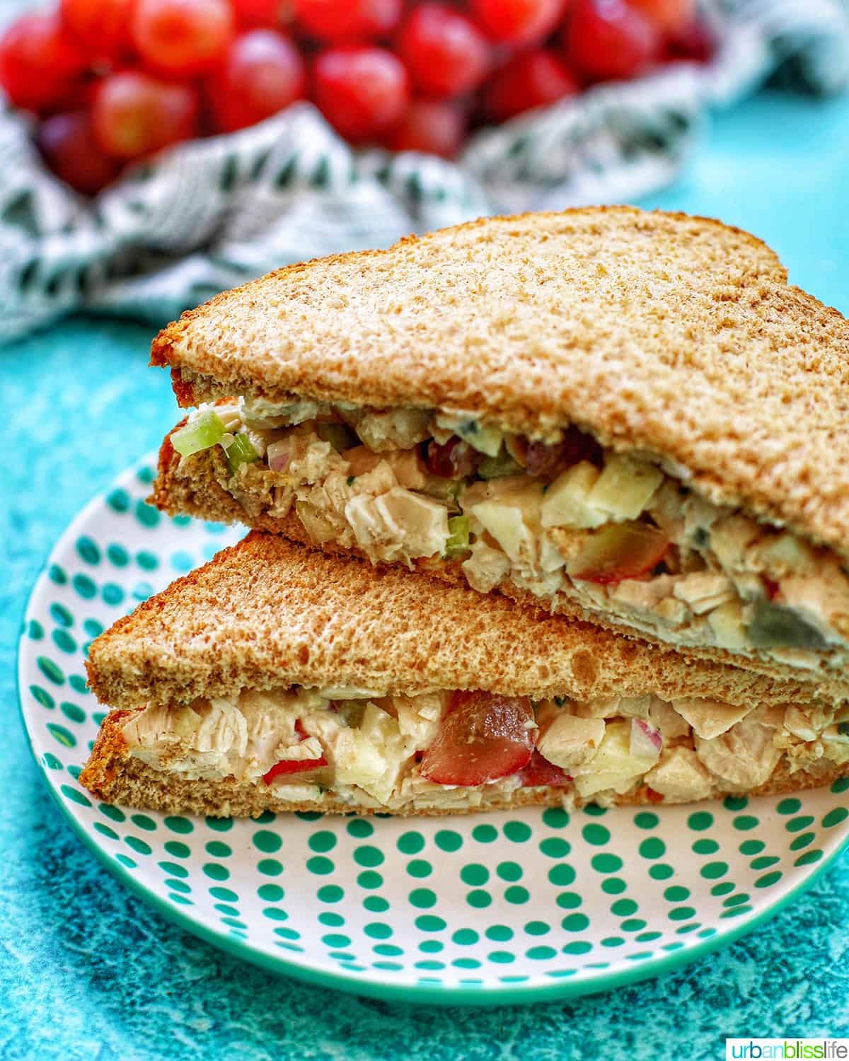 chicken salad tea sandwiches stacked on a plate