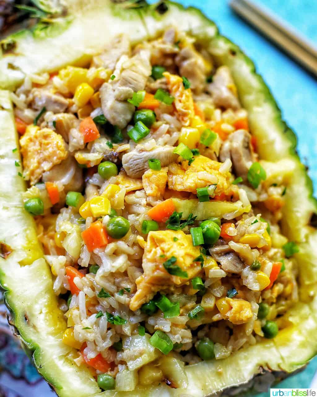 chicken pineapple fried rice in hollowed out pineapple boat