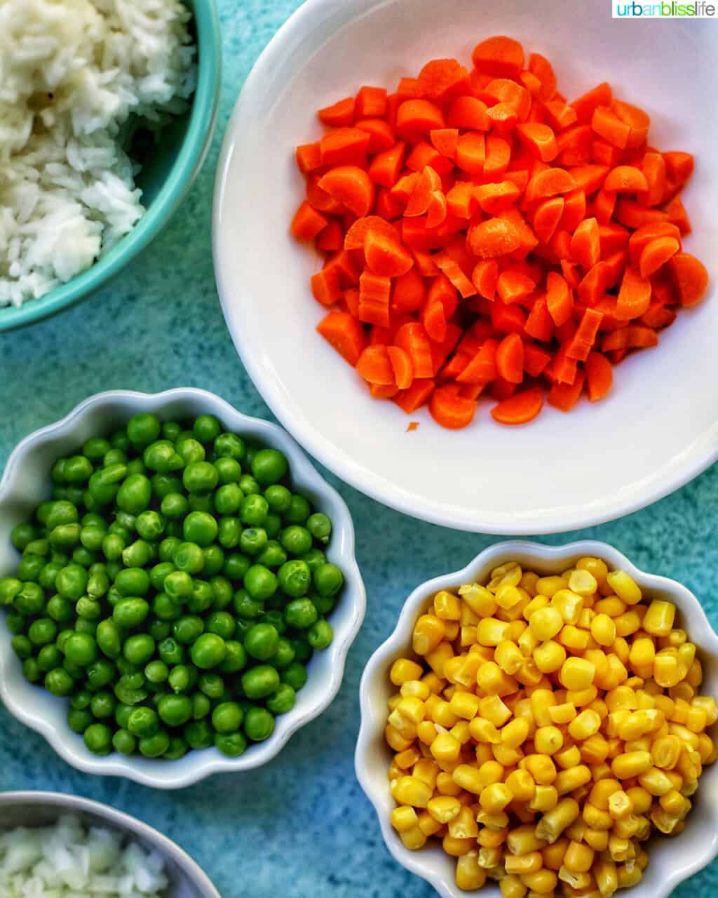 bowls of carrots peas and corn