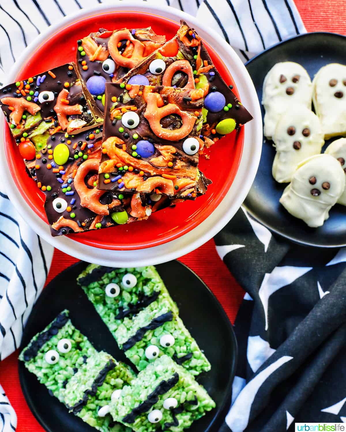 trio of Halloween treats on orange, black, and white plates.