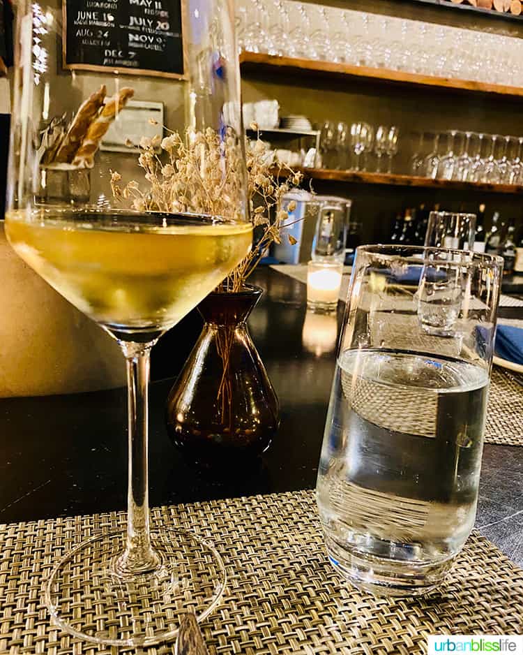 glass of white wine and glass of water at Arden restaurant in Portland, Oregon.