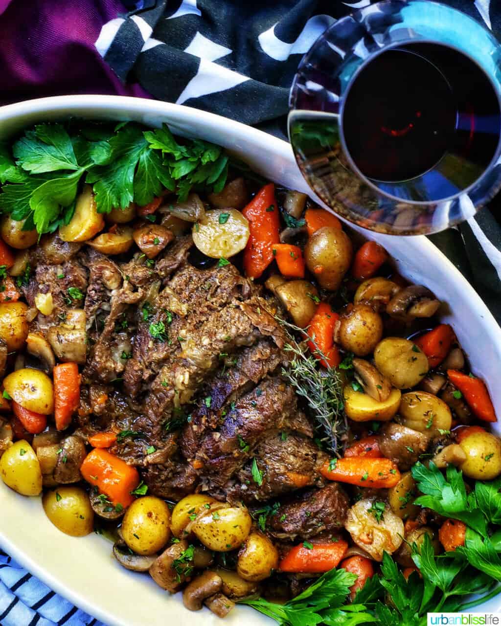 dutch oven pot roast with glass of red wine