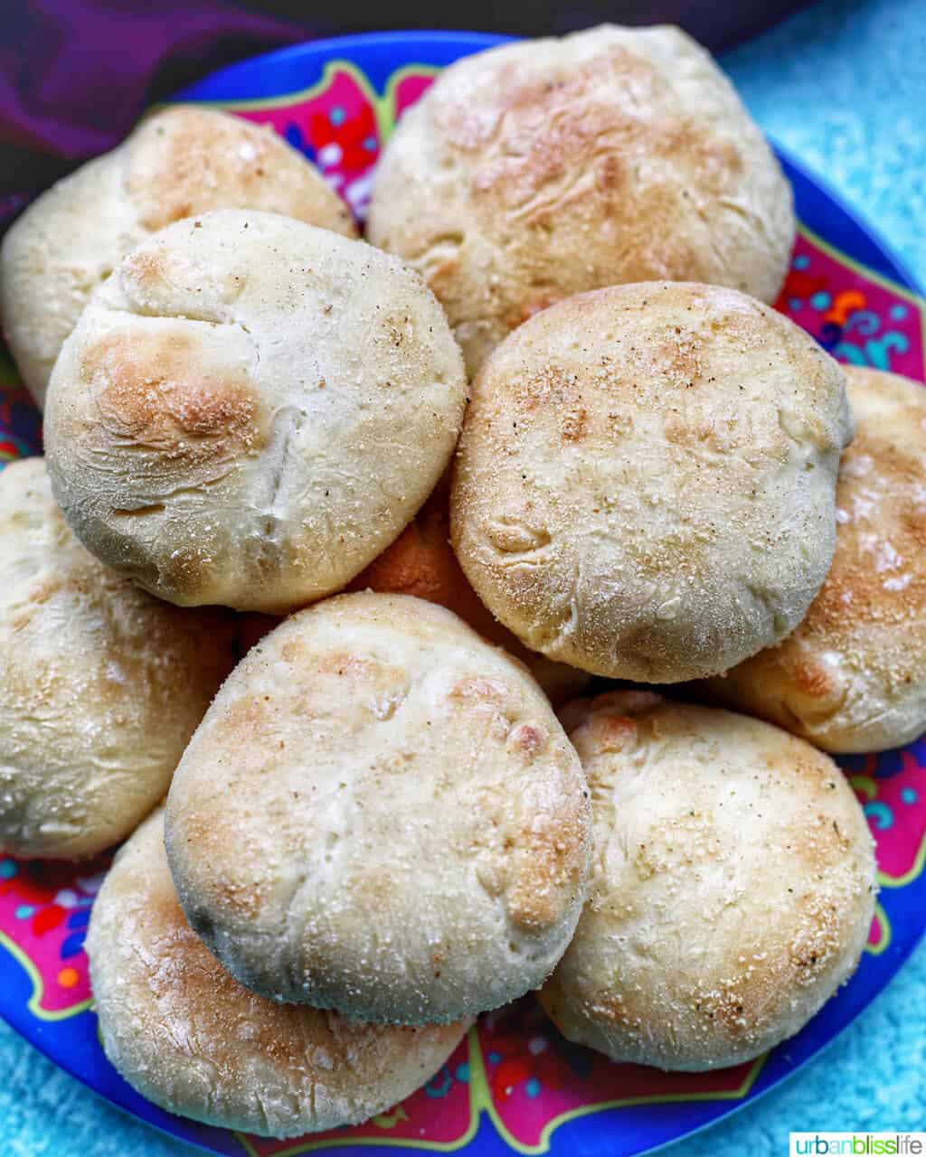 colorful plate with baked Filipino Pandesal rolls