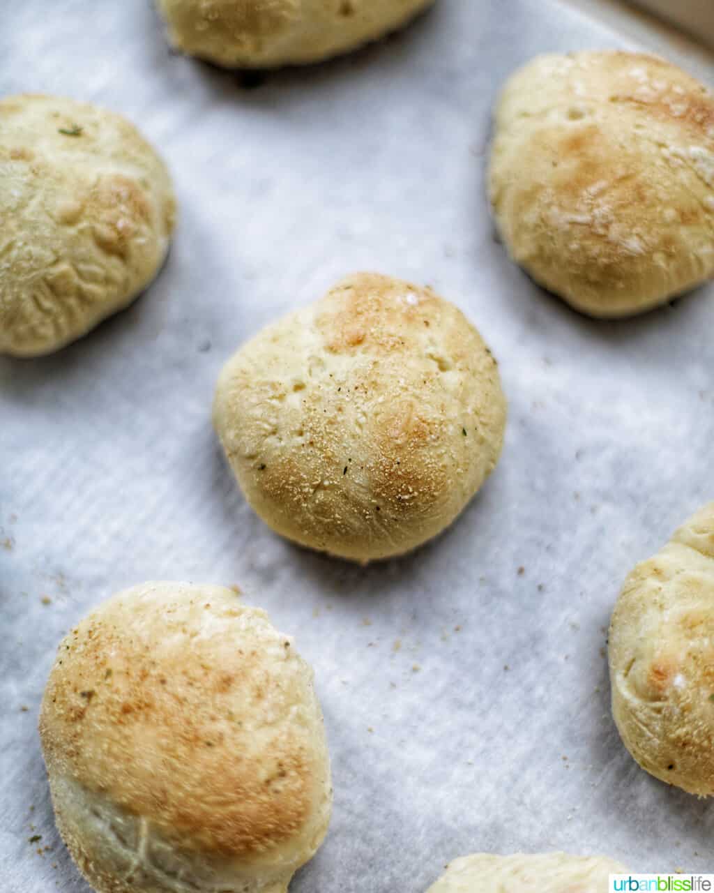 baked pandesal rolls on a pan