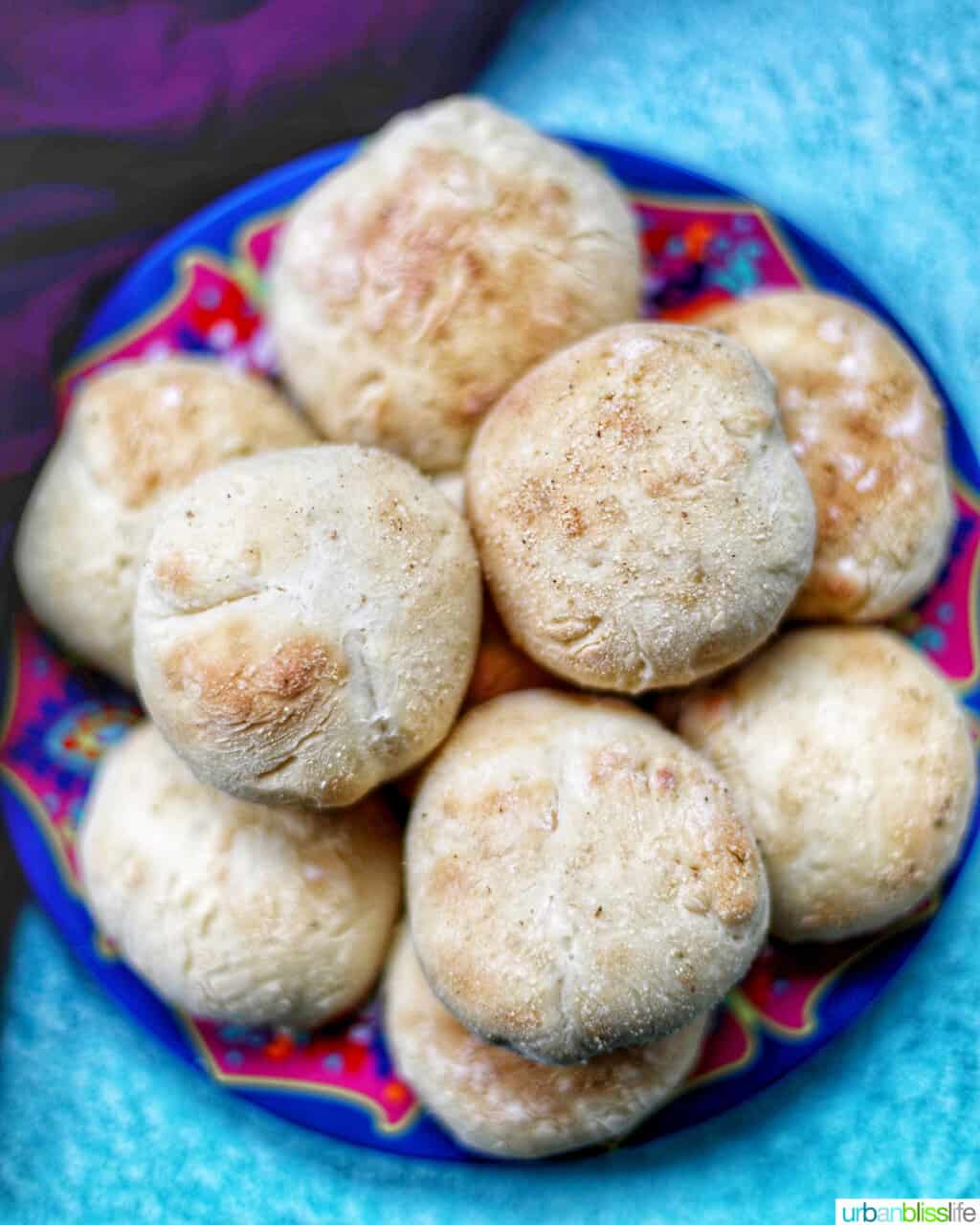 colorful plate with baked Filipino Pandesal rolls