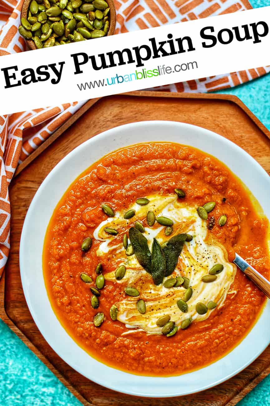 bowl of creamy vegan pumpkin soup with Pinterest text overlay