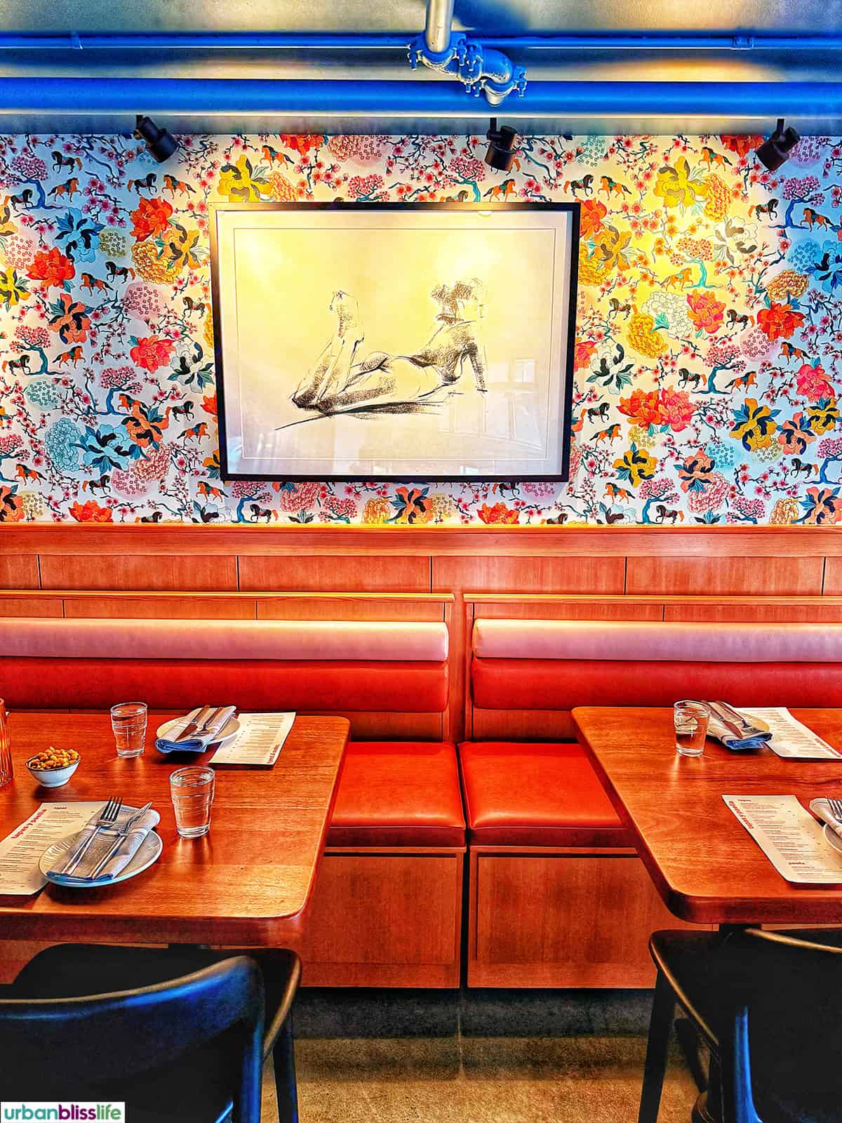 colorful wallpaper and bench seating at Vya PDX restaurant.