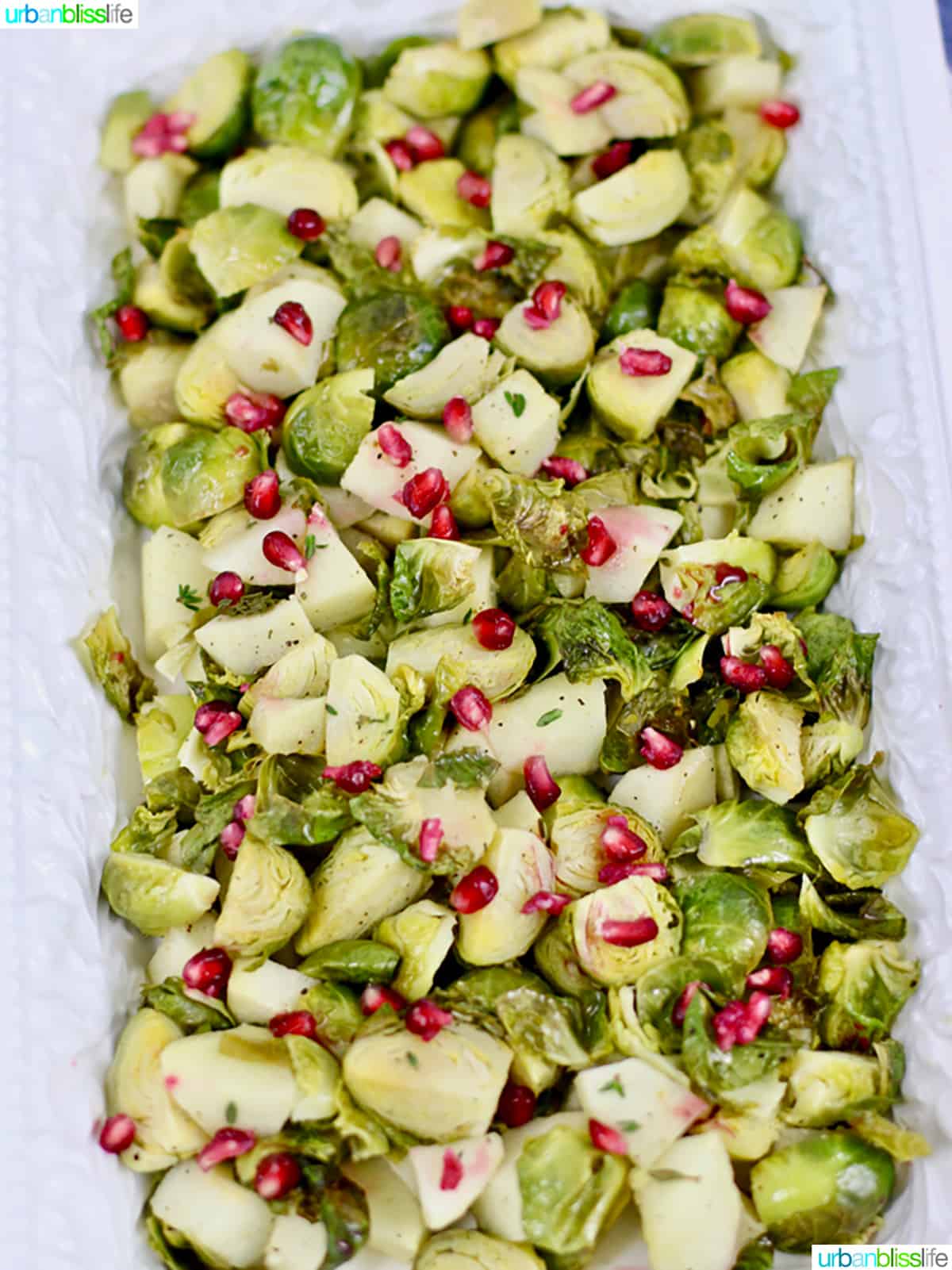 serving platter with roasted brussels sprouts, apples, pomegranate