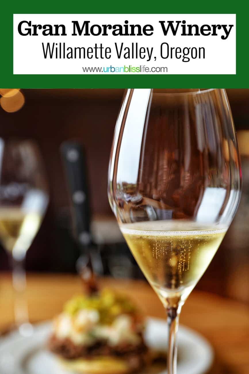 Glass of sparkling wine at Gran Moraine Winery with text overlay