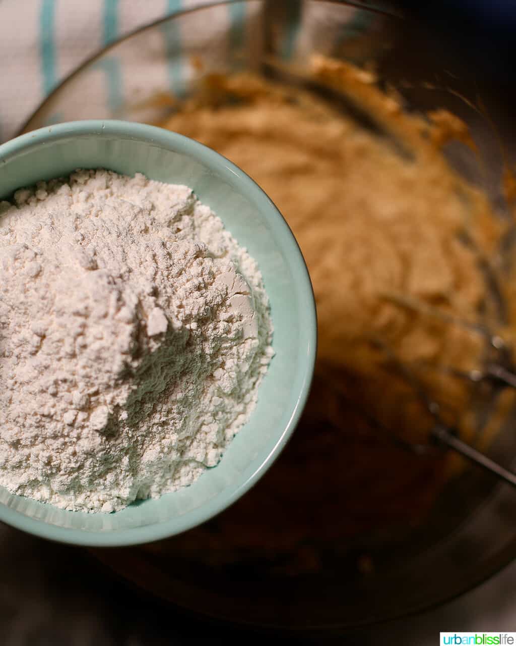 adding flour to cookie batter