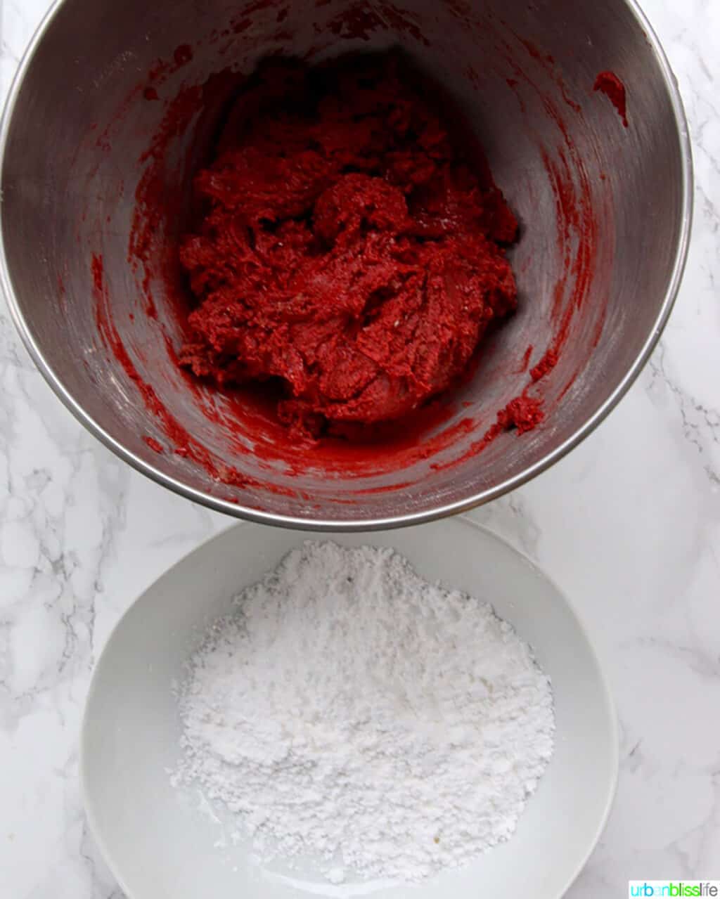 red velvet crinkle cookie dough and powdered sugar